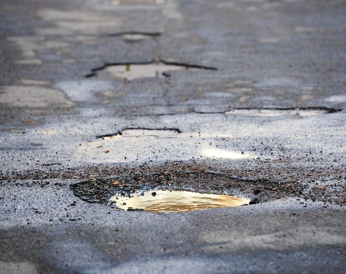 How Do Potholes Form & How to Report Them