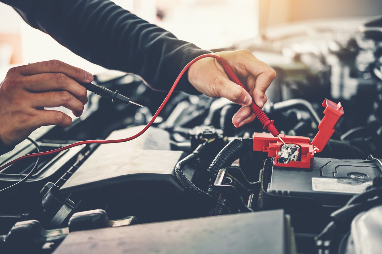 image of mechanic working on a car