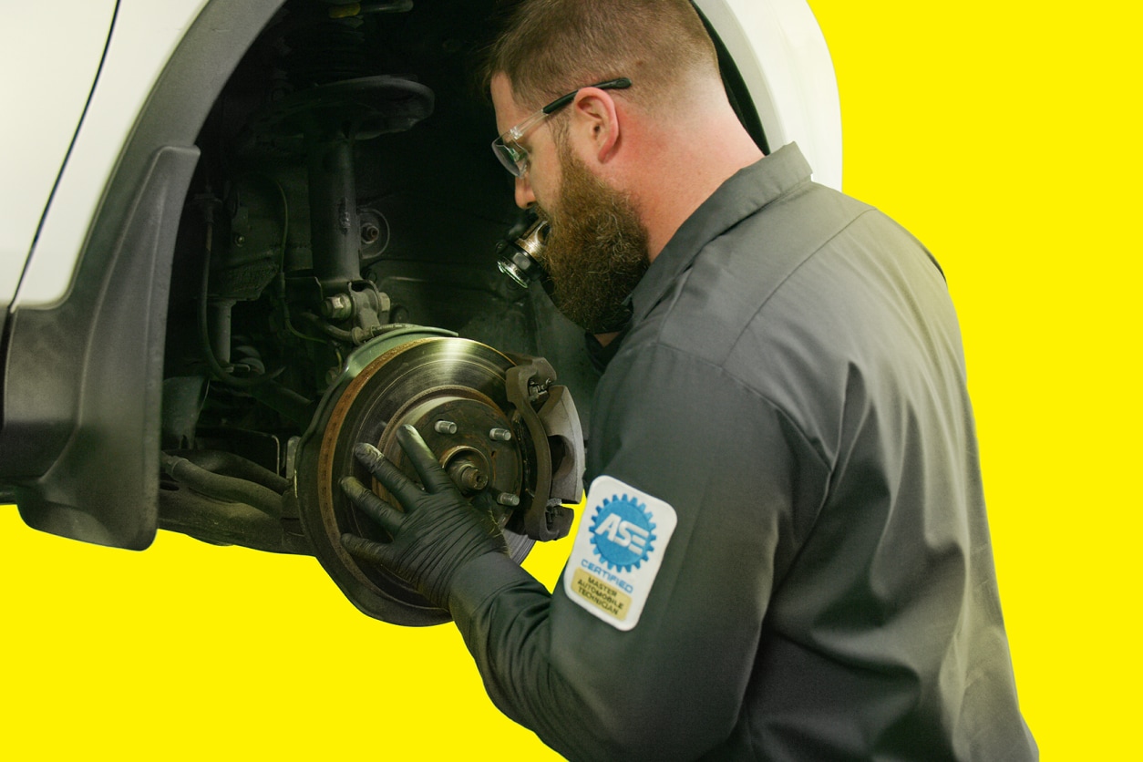 Mechanic adjusting drum brakes